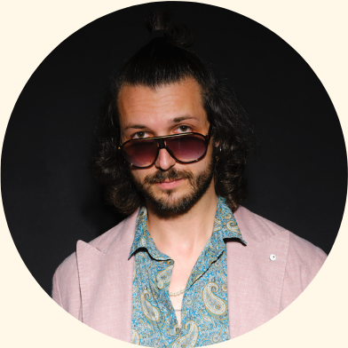 Mad Mantello with sunglasses and a pink jacket